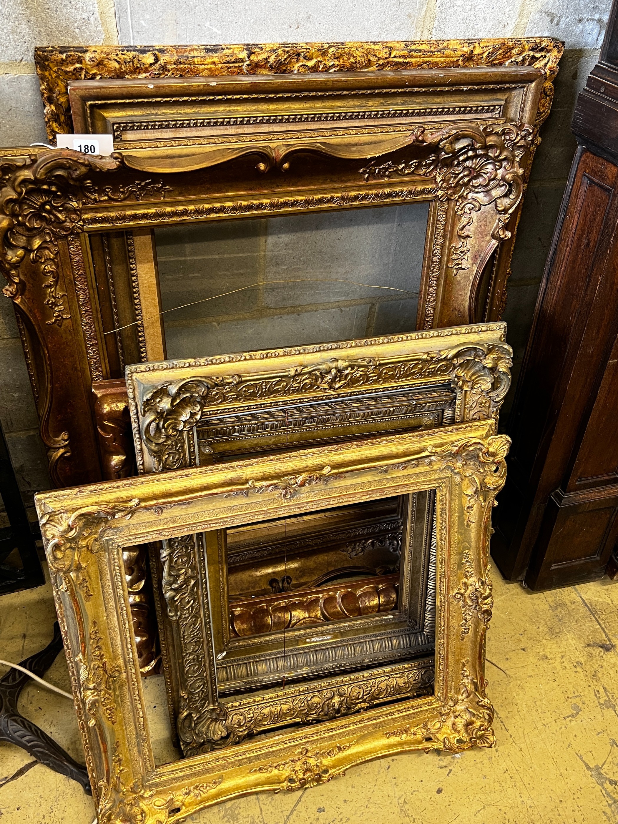 Eight Victorian and later giltwood and composition rectangular picture frames, largest 76 x 94cm